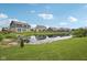 Picturesque pond view showcasing the community homes and reflecting serene waters at 13163 N Departure W Blvd, Camby, IN 46113