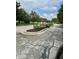 Attractive community entrance with brick signage and mature landscaping, creating a welcoming atmosphere at 13225 Deception Pass # 1200, Fishers, IN 46038