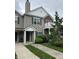 Charming townhouse featuring a mix of vinyl siding and brick accents, with a private balcony and well-manicured landscaping at 13225 Deception Pass # 1200, Fishers, IN 46038