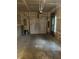 Two car garage featuring a garage door opener, utility panel, and concrete floors at 13225 Deception Pass # 1200, Fishers, IN 46038