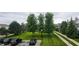 View of the grassy and well-manicured neighborhood with mature trees at 13225 Deception Pass # 1200, Fishers, IN 46038