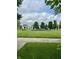 Community playground with climbing structures, surrounded by a grassy area, creating a fun and safe environment at 13225 Deception Pass # 1200, Fishers, IN 46038
