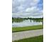 Wide view of the scenic pond with fountain, surrounded by lush greenery, offering a peaceful retreat at 13225 Deception Pass # 1200, Fishers, IN 46038