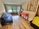Bright attic space features natural light from large windows and light wood floors at 1336 Lafayette Ave, Columbus, IN 47201