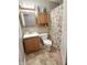 Full bathroom featuring oak cabinets and a patterned shower curtain at 1336 Lafayette Ave, Columbus, IN 47201