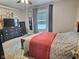 Bedroom with TV and dresser near window at 1336 Lafayette Ave, Columbus, IN 47201