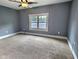 Large empty bedroom with a neutral carpet and gray walls at 1336 Lafayette Ave, Columbus, IN 47201