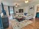 Spacious living room featuring hardwood floors, comfortable seating, and natural light at 1336 Lafayette Ave, Columbus, IN 47201