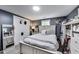 Bedroom featuring gray walls, closet space, and a white bed at 1617 S Whittier Pl, Indianapolis, IN 46203
