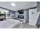 Comfortable bedroom with a TV and white walls at 1617 S Whittier Pl, Indianapolis, IN 46203