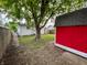 Backyard featuring a red shed and a wood fence at 1653 Wade St, Indianapolis, IN 46203