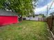 Backyard featuring a red shed and a wood fence at 1653 Wade St, Indianapolis, IN 46203
