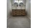 Bathroom featuring a double sink vanity, tile floor, and modern lighting at 1653 Wade St, Indianapolis, IN 46203