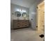 Bathroom featuring a double sink vanity, tile floor, and modern lighting at 1653 Wade St, Indianapolis, IN 46203