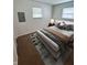 Bedroom features neutral color scheme, geometric rug, and soft lighting, creating a relaxing atmosphere at 1653 Wade St, Indianapolis, IN 46203