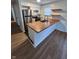 Updated kitchen with stainless steel appliances, butcher block countertops, and sleek floating shelves at 1653 Wade St, Indianapolis, IN 46203