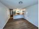 Bright open concept living room, featuring the modern kitchen and sleek vinyl plank flooring at 1653 Wade St, Indianapolis, IN 46203