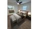 Well-lit main bedroom with a plush bed and direct access to a modernly renovated bathroom at 1653 Wade St, Indianapolis, IN 46203
