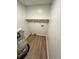 Utility room featuring laminate floors and a water heater at 1653 Wade St, Indianapolis, IN 46203