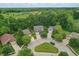 Aerial shot of well-maintained homes in a lush, green neighborhood with mature trees and landscaping at 16732 Maraschino Dr, Noblesville, IN 46062