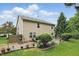 Spacious backyard featuring a patio area, lush greenery, and a well-maintained lawn at 16732 Maraschino Dr, Noblesville, IN 46062