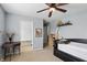 Bright bedroom featuring a daybed, desk, and ceiling fan at 16732 Maraschino Dr, Noblesville, IN 46062