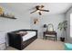 Cozy bedroom with a ceiling fan and a comfortable daybed, illuminated by natural light at 16732 Maraschino Dr, Noblesville, IN 46062