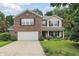 Charming two-story home with brick and siding, a two-car garage, and a landscaped front yard at 16732 Maraschino Dr, Noblesville, IN 46062