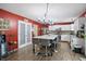Modern kitchen with a large island, stainless steel appliances, and a stylish chandelier at 16732 Maraschino Dr, Noblesville, IN 46062