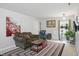 Inviting living room with a comfortable sofa, stylish rug, and natural light at 16732 Maraschino Dr, Noblesville, IN 46062