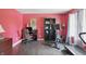 Office area featuring a desk, shelving, and exercise equipment, illuminated by natural light from a window at 16732 Maraschino Dr, Noblesville, IN 46062