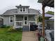 Charming house with a well-manicured lawn, patio area, and tasteful landscaping at 1728 Newton St, Columbus, IN 47201