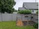 Fenced backyard featuring a garden, shed and green grass at 1728 Newton St, Columbus, IN 47201