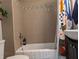 Well-lit bathroom with a shower and tub at 1728 Newton St, Columbus, IN 47201