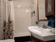 Bathroom features white subway tile shower with a framed mirror at 1728 Newton St, Columbus, IN 47201