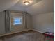 Cozy bedroom featuring carpet and light filled window at 1728 Newton St, Columbus, IN 47201