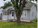 Charming home featuring gray siding, well-manicured lawn, and an inviting entrance with a decorative wreath at 1728 Newton St, Columbus, IN 47201