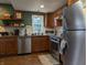 Featuring stainless steel appliances, the kitchen offers ample counter space and stylish finishes at 1728 Newton St, Columbus, IN 47201