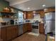 Well-appointed kitchen featuring stainless steel appliances, white subway tile backsplash, and wooden cabinets at 1728 Newton St, Columbus, IN 47201