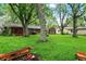 Well-maintained backyard with mature trees providing ample shade and room for recreation at 1926 Fairmont Ct, Indianapolis, IN 46229