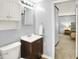 The bathroom features a dark vanity, toilet, mirror, and sink at 1926 Fairmont Ct, Indianapolis, IN 46229