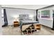 This bedroom has a gray bed with storage space at the foot, end tables, and carpet flooring at 1926 Fairmont Ct, Indianapolis, IN 46229