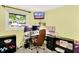 Functional bedroom with office setup includes a work space and window view at 1926 Fairmont Ct, Indianapolis, IN 46229