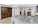 Spacious bedroom includes an open doorway, closet, end table, carpet flooring, and neutral walls at 1926 Fairmont Ct, Indianapolis, IN 46229