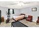 Bedroom featuring carpet flooring, a window with blinds, a ceiling fan, and a bed at 1926 Fairmont Ct, Indianapolis, IN 46229
