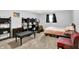 Bedroom features carpet flooring, a window with blinds, a bed, and an assortment of furniture at 1926 Fairmont Ct, Indianapolis, IN 46229