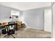 Bright bedroom with natural light, neutral carpet, and functional desk and chair at 1926 Fairmont Ct, Indianapolis, IN 46229