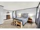 This bedroom features carpet flooring, a large bed, an end table, and natural light at 1926 Fairmont Ct, Indianapolis, IN 46229