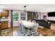 Dining room featuring a large table with chairs, hardwood floors, and an open concept design at 1926 Fairmont Ct, Indianapolis, IN 46229