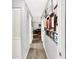 Hallway with neutral walls, carpeted flooring, photo gallery, and view into the living room at 1926 Fairmont Ct, Indianapolis, IN 46229
